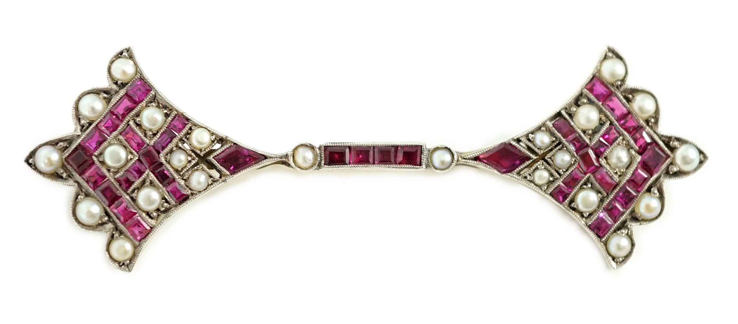 An early 20th century, gold, platinum, ruby and seed pearl set brooch